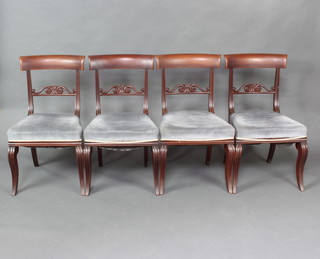 A set of 4 19th Century Irish mahogany bar back dining chair with pierced mid rails and over stuffed seats raised on sabre supports