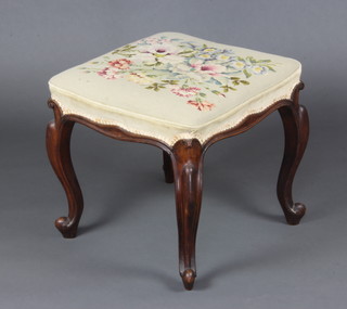 A Victorian square rosewood stool with Berlin woolwork seat, on cabriole supports 44cm x 50cm x 49cm 
