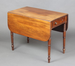 A William IV bleached mahogany Pembroke table fitted a drawer and raised on ring turned supports 66cm h x 81cm w x 46cm d 
