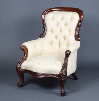 A Victorian mahogany show frame tub back chair upholstered in yellow material raised on cabriole supports 
