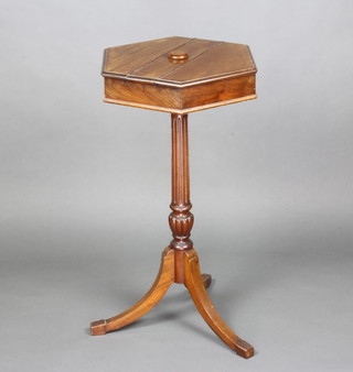 A Victorian hexagonal mahogany shaving stand raised on a turned and fluted column with tripod base 86cm h x 49cm w x 43cm d 
