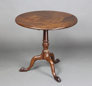 A 19th Century circular mahogany snap top table, raised on a turned column and tripod base 71cm x 76cm diam. 