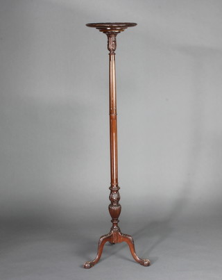 An Edwardian turned and fluted mahogany torchere raised on a tripod base 147cm x 30cm diam. (in 2 sections) 