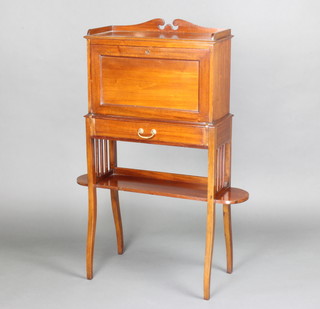 An Edwardian mahogany student's bureau with raised back, the fall front revealing a well fitted interior above 1 long drawer, the base fitted a shelf and raised on square tapered supports 115cm h x 82cm w x 25cm d 