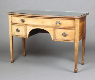 A 19th Century bleached mahogany bow front dressing/side table fitted 1 long drawer above 2 short drawers, raised on square tapered supports ending in spade feet 77cm h x 109cm w  x 50cm d 