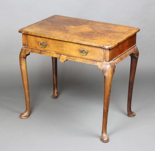 A Queen Anne figured walnut and cross banded side table fitted a drawer and raised on cabriole supports, the drawer bearing a label H Mawtr and Stephenson Antique and Modern Furniture Exchange  221, 223, 226, 227, 229, 231 and 233 Fulham Road South Kensington 72cm h x 76cm w x 51cm d 