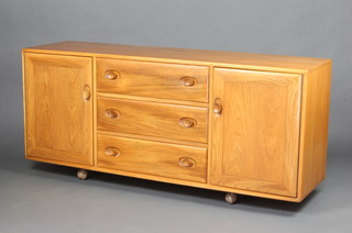 A mid 20th Century elm Ercol "Windsor" sideboard fitted 3 long drawers flanked by a pair of cupboards  70cm h x 155cm w x 43cm d 