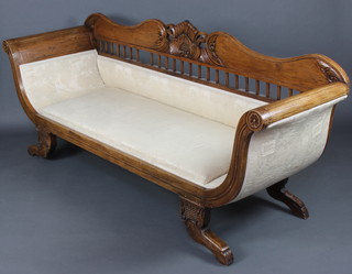 A William IV style carved mahogany show frame sofa upholstered in cream material and raised on shaped supports 91cm h x 213cm w x 65cm d  