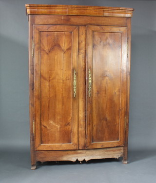 An 18th/19th Century French fruitwood armoire with moulded cornice, fitted a shelf and 3 short drawers enclosed by a pair of panelled doors raised on shaped feet 209cm h x 139cm w x 61cm d 

