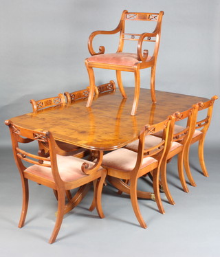 A Georgian style yew dining suite comprising crossbanded D end dining table raised on pillar and tripod supports with 1 extra leaf 106cm h x 182cm l x 40cm w  together with a set of 8 Regency style mahogany and figured walnut bar back dining chairs - 2 carvers, 6 standard  
