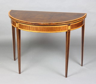 A 19th Century mahogany D shaped folding card table with crossbanded top raised on square tapered supports 73cm x 99cm x 49cm (some veneers missing in places) 