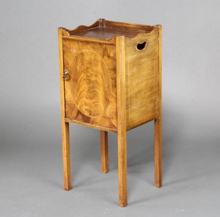 A Georgian style mahogany tray top pot cupboard/bedside cupboard enclosed by a panelled door, raised on square tapering supports 79cm x 36cm x 30cm 
