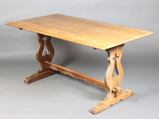 An Old Charm oak refectory style dining table raised on pierced shaped supports with H framed stretcher 75cm h x 152cm l x 83cm w 