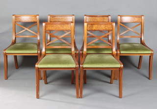 A set of 6 Regency style mahogany and figured walnut bar back dining chairs with X framed mid rails and upholstered drop in seats 