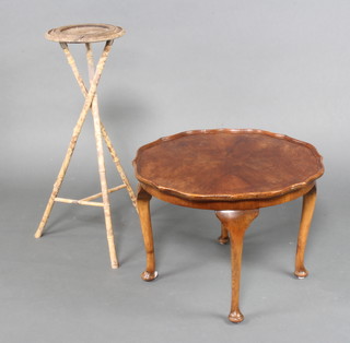 A circular Queen Anne style walnut coffee table with quarter veneered top raised on cabriole supports 43cm h x 62cm together with a circular oak and bamboo jardiniere stand 79cm x 28cm diam. 