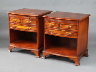 A pair of Georgian style mahogany bow front bedside cabinets with crossbanded tops, fitted brushing slide above 2 short, 1 long drawer and a recess, raised on splayed bracket feet 67cm h x 57cm w x 49cm d (1 with slight water damage to the top) 