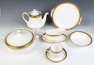 A Paragon Athena pattern tea and dinner service comprising 12 tea cups, 12 saucers, tea pot, milk jug, sugar bowl, sandwich plate, 12 dessert bowls,12 small plates, 12 medium plates, 12 dinner plates, sauceboat and stand,2 tureens and covers and a meat plate