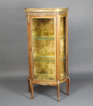 A D shaped French walnut vitrine with pink veined marble top and pierced gilt gallery, the interior fitted shelves enclosed by a bow front panelled door, raised on cabriole supports with gilt metal mounts throughout 140cm h x 66cm w x 33cm d 