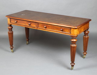A Victorian mahogany Gillows style writing table with inset writing surface above 2 long drawers, raised on turned and reeded supports 72cm h x 139cm w x 60cm d 