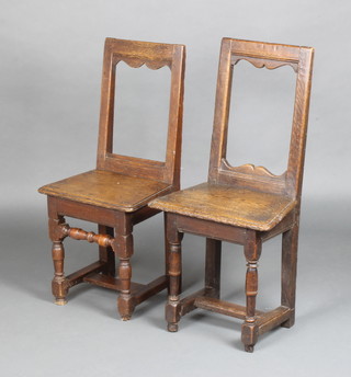 A pair of 17th/18th Century oak chair back stools, raised on turned and block supports