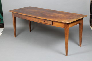 A 19th Century French cherry farm house kitchen table, the top planked and structured, fitted a frieze drawer and raised on square tapered supports 74cm h x 186cm l x 79cm w 