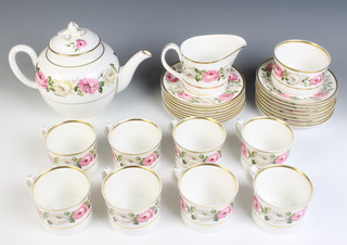 A Royal Worcester Royal Garden tea set comprising 8 tea cups, 8 saucers, 8 small plates, tea pot, milk jug and sugar bowl