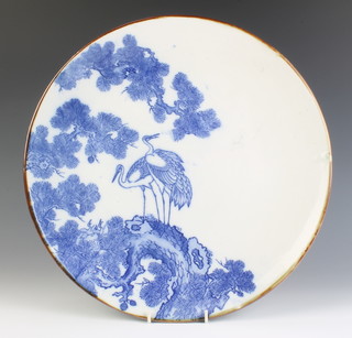 An early 20th century Japanese charger with heron amongst trees, impressed mark 38cm
