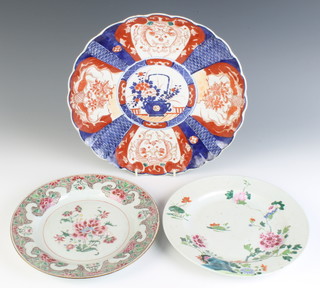 An 18th century famille rose plate decorated with flowers 23cm, a ditto 23cm and an Imari scalloped dish 30cm
