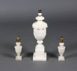 A carved alabaster table lamp raised on a square base 46cm x 13cm together with 2 small ditto 18cm x 6cm 