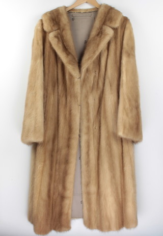 A lady's full length blonde mink coat by Fred Nettler  