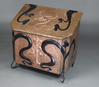 An Art Nouveau style hammered copper coal bin, the top embossed a dragon raised on wrought iron supports 63cm h x 66cm w x 44cm d 