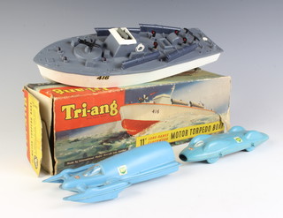 A Tri-ang 11" clockwork motor torpedo boat no 4165 together with a two plastic Jetex powered models of Donald Campbells Bluebird car and speedboat.