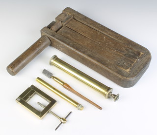 A 19th Century wooden bird scaring rattle, a brass cased thermometer, a large brass syringe, a Bush and Chipper glass cutter and other curios 