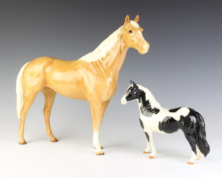A Beswick figure of a Large Hunter Palomino no. 1734, 32cm, a ditto Pinto Pony no. 1373 17cm  