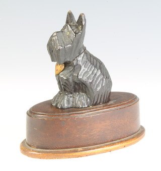 An Art Deco table lighter, the top decorated a carved wooden Scottie dog 11cm x 12cm x 7cm 