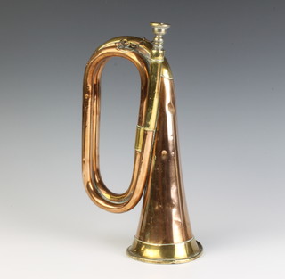 A copper and brass bugle, some dents 