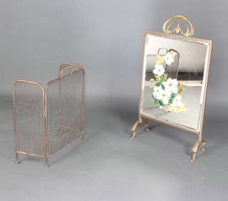 An Art Nouveau brass and mirrored bevelled glass fire screen with floral decoration 81cm x 45cm x 21cm together with a brass and mesh 3 fold spark guard 56cm h x 75cm w (missing foot) 