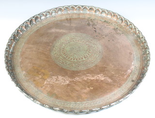 An Eastern circular engraved copper charger with raised scallop edge 5cm x 69cm 