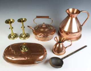 A Victorian oval copper and brass foot warmer 7cm x 36cm x 23cm, a squat copper kettle (some dents), 2 reproduction harvest measures, a pair of brass candlesticks and an iron ladle 