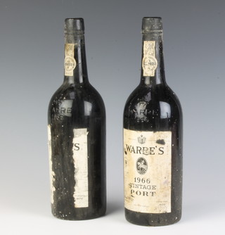 Two bottles of 1966 Warre's vintage port, 1 with damaged label 