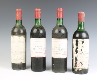 A bottle of 1969 Chateau Mouton Baron Philippe Grand Cru Pauillac, 2 bottles of 1976 Grand Vin Chateau Lynch Bages Grand Cru Classe Pauillac together with a bottle of Chateau wine, label damaged  
