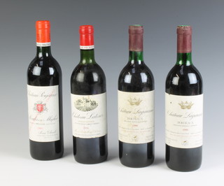 A bottle of 1981 Chateau Latour Bordeaux, a bottle of 1985 Chateau Poujeaux and 2 bottles of 1990 Chateau Lagarenne  
