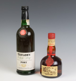 A bottle of Taylor's Chip Dry finest old extra dry white port together with a  35cl bottle of Grand Marnier 