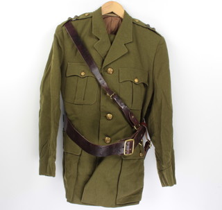 A Lieutenant's General Service Corps dress tunic and trousers complete with Sam Browne belt, sword frog (no collar dogs) together with a Westminster Dragoon guards service dress, jacket and trousers by Moss Bros. no pips or collar dogs 