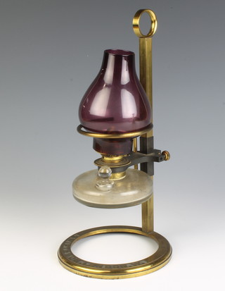 A Swift and Sons spirit burner raised on an adjustable brass stand