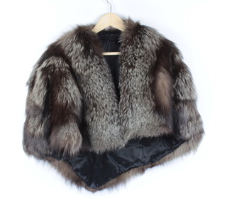 A lady's silver fox fur cape together with a brown fur stole 