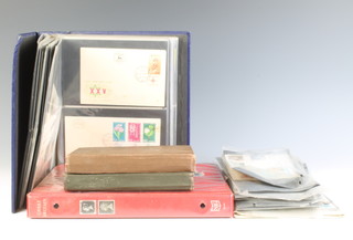 A Stanley Gibbons album of Victorian to Elizabeth II mint and used stamps, 2 stock books of world stamps and a collection of first day covers 