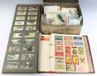 An album of match box covers, an album of cigarette cards together with 10 containing cigarette cards etc 
