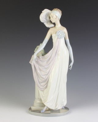 A Lladro figure of a lady standing by a column with an urn of flowers 33cm 