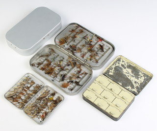 A 1920's Hardy 9 compartment fly box, a Hardy Bros. clipped fly box and contents, a Wheatley swing leaf fly box and 1 other 